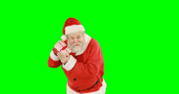 Santa claus holding a gift box — Stock Video