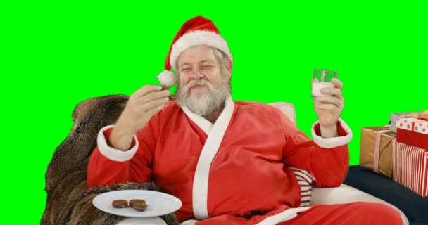 Santa claus relaxing on couch — Stock Video