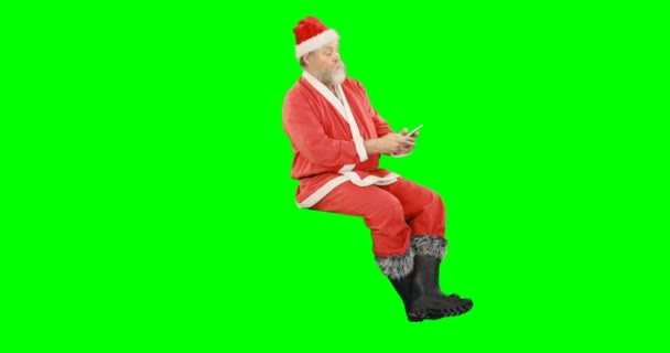 Santa claus using mobile phone — Stock Video