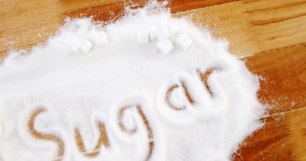 Azúcar escrito en polvo de azúcar — Vídeo de stock