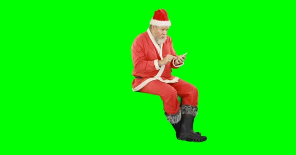 Jultomten talar i mobiltelefon — Stockvideo