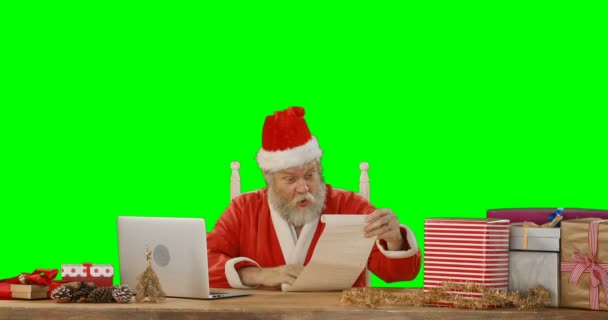 Santa claus using laptop — Stock Video