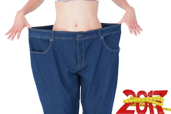 Woman wearing too large pants — Stock Photo, Image