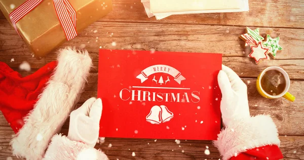 Jultomten som håller en röd skylt — Stockfoto