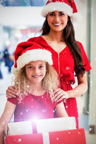 Mother and daughter in Christmas attire — Stock Photo, Image