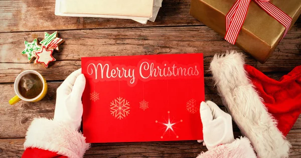 Santa claus holding a red placard — Stock Photo, Image