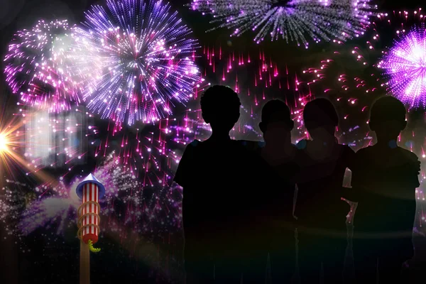 Silhouette children standing against colourful fireworks — Stock Photo, Image