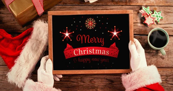 Santa claus drží břidlice — Stock fotografie
