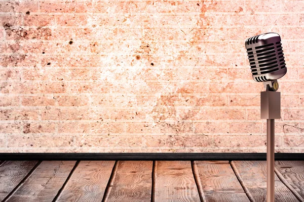 Retro microphone against stone wall — Stock Photo, Image