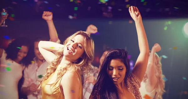 Friends holding champagne while dancing — Stock Photo, Image