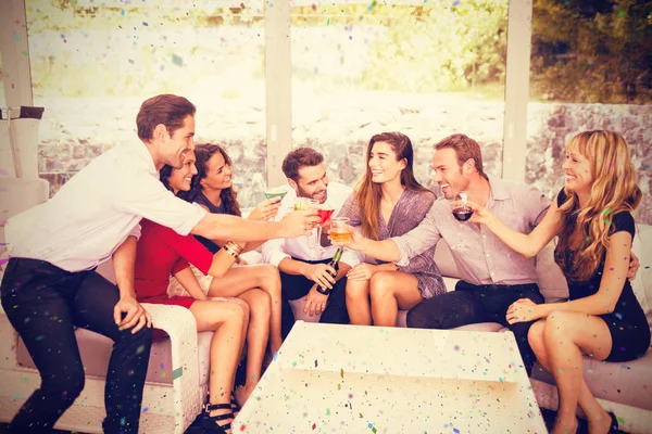 Group of friends toasting and having drinks — Stock Photo, Image