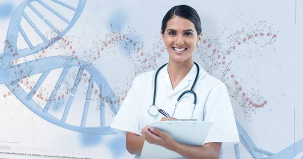 Female doctor writing on clipboard — Stock Photo, Image