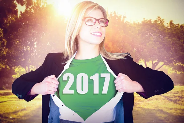 Businesswoman opening shirt in superhero style — Stock Photo, Image