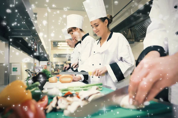 Chefs preparing food at counter — Stock Photo, Image