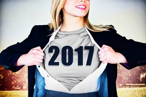 Businesswoman opening shirt in superhero style — Stock Photo, Image