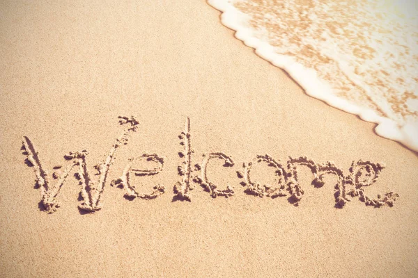 Welcome written on sand — Stock Photo, Image