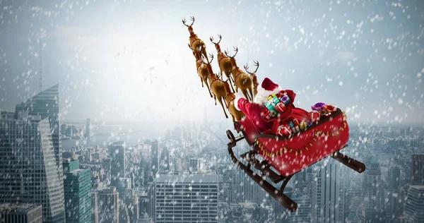 Jultomten ridning på släde med presentaskar — Stockfoto