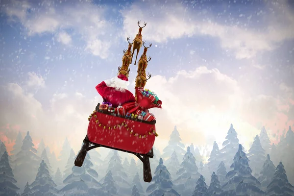 Papai Noel montando no trenó contra a queda de neve — Fotografia de Stock