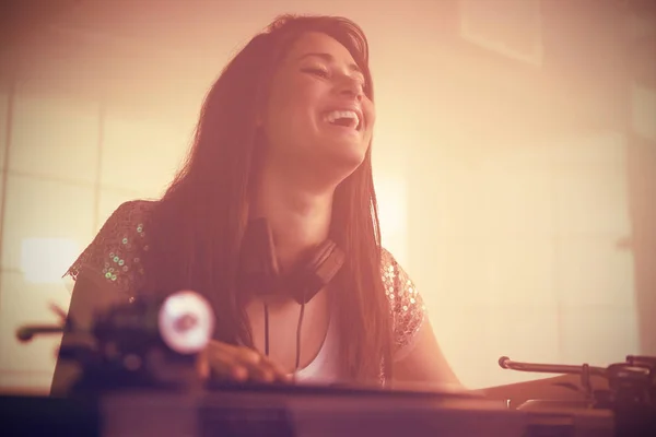 Pretty female DJ playing music — Stock Photo, Image