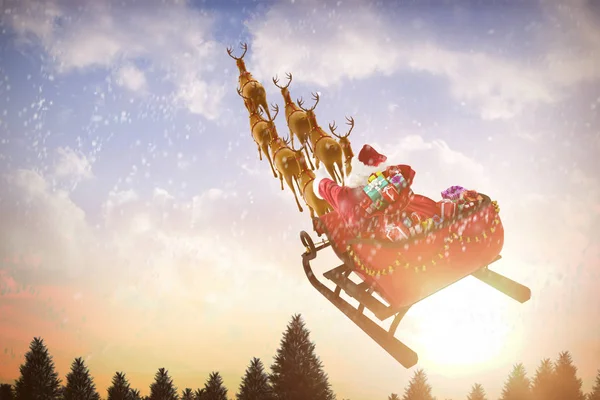 Santa Claus riding on sled with gift boxes — Stock Photo, Image