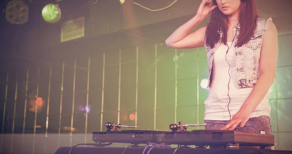 Pretty female DJ playing music — Stock Photo, Image