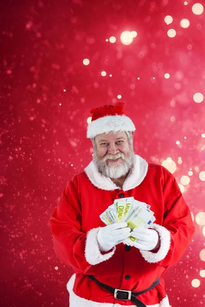 Père Noël montrant des billets de monnaie — Photo