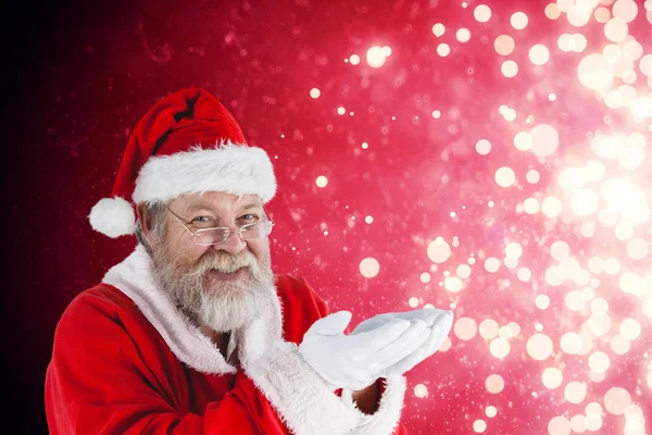 Santa claus s rukama přiložil — Stock fotografie