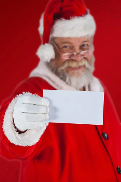 Papai Noel segurando papel em branco — Fotografia de Stock