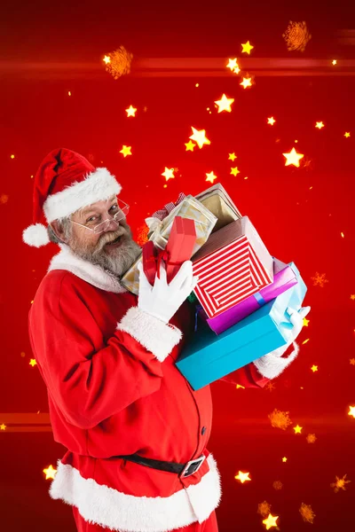 Mutlu Noel tutan santa sunar — Stok fotoğraf