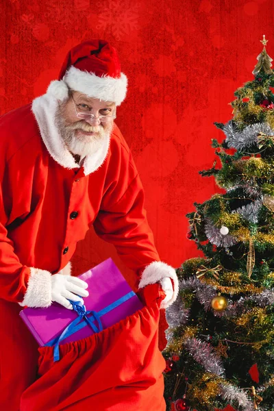 Santa claus with christmas presents — Stock Photo, Image