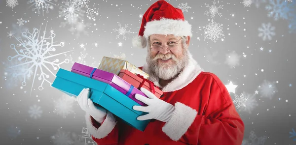 Santa claus håller jul presenterar — Stockfoto