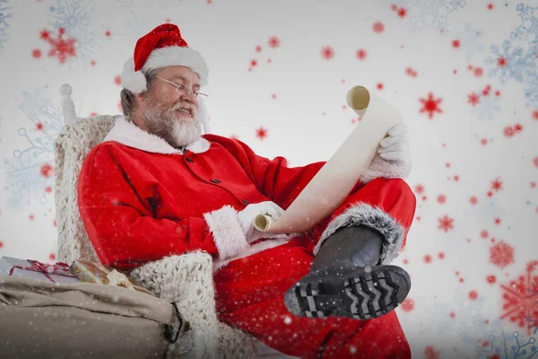 Santa claus reading wish list — Stock Photo, Image