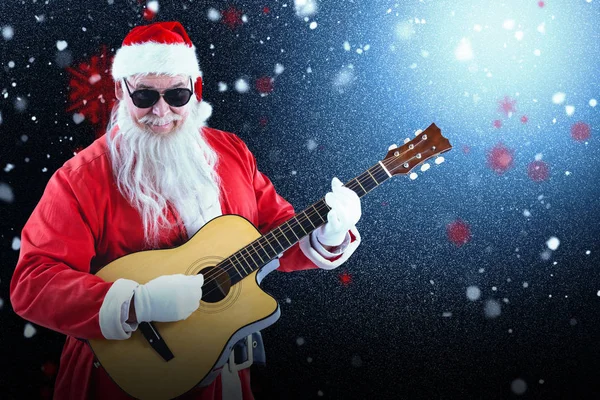 Santa claus playing guitar — Stock Photo, Image