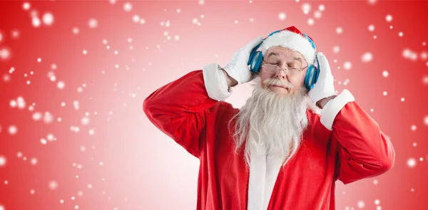 Santa claus poslechu hudby — Stock fotografie