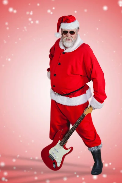 Santa claus standing with guitar — Stock Photo, Image