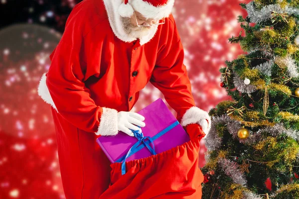 Santa Claus embalaje bolsa de Navidad —  Fotos de Stock