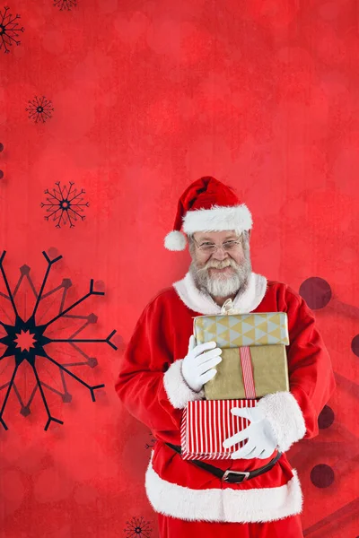 Santa claus håller jul presenterar — Stockfoto