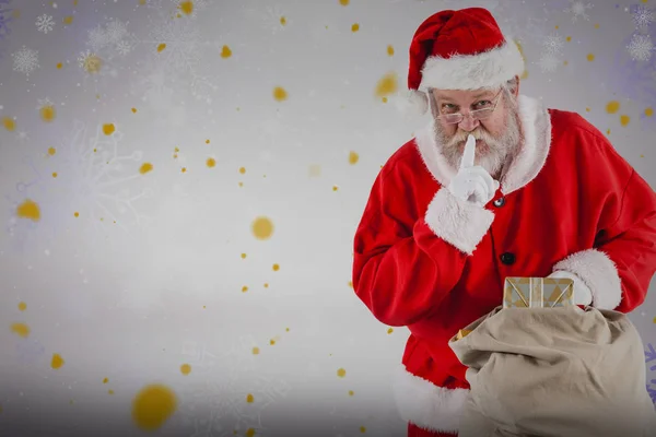 Weihnachtsmann mit Finger auf den Lippen — Stockfoto
