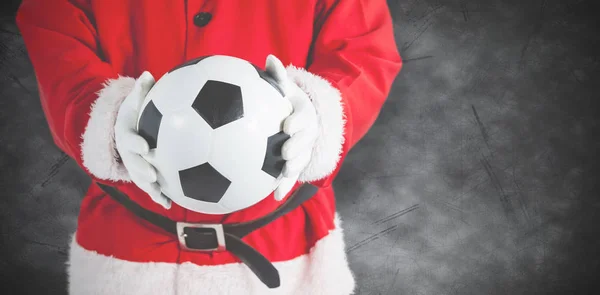 Santa Claus innehar en fotboll — Stockfoto