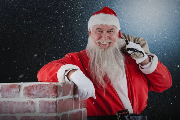 Santa claus s taškou plnou dárků — Stock fotografie