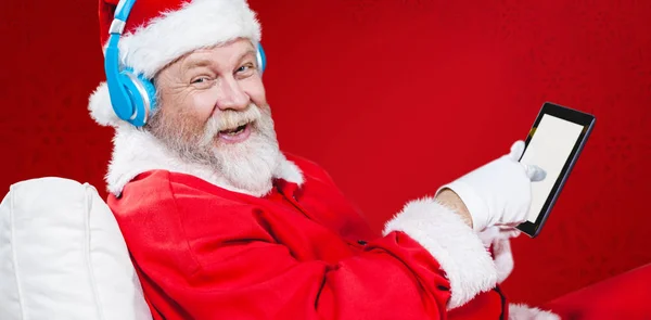 Papai Noel ouvir música — Fotografia de Stock
