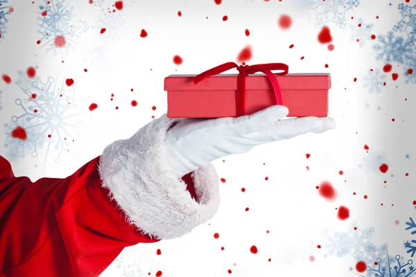 Santa claus holding a gift box — Stock Photo, Image