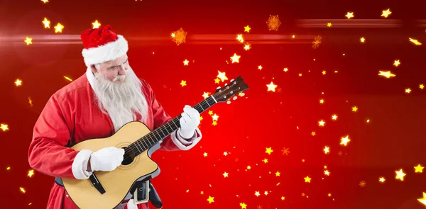 Weihnachtsmann spielt Gitarre — Stockfoto