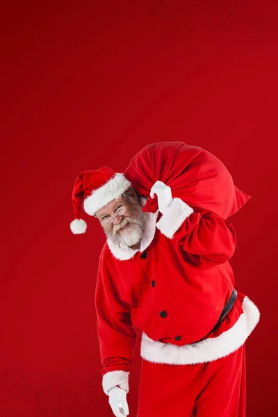 Santa Claus sosteniendo bolsa de Navidad — Foto de Stock