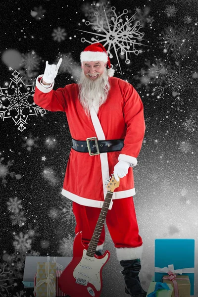 Santa claus s kytarou a různé dárkové — Stock fotografie