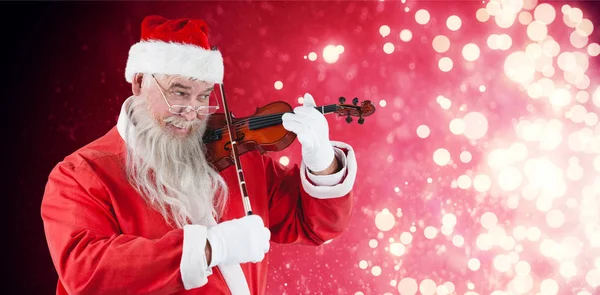 Santa claus playing violin — Stock Photo, Image