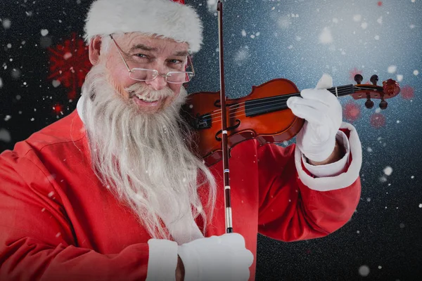 Weihnachtsmann spielt Geige — Stockfoto