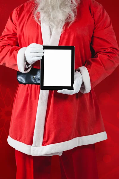 Weihnachtsmann zeigt digitales Tablet — Stockfoto