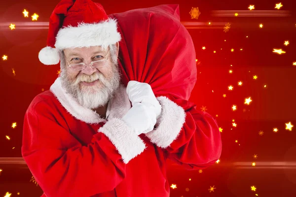 Santa claus håller jul säck — Stockfoto