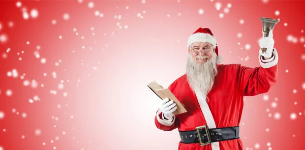 Santa claus trzymając Biblię i dzwon — Zdjęcie stockowe